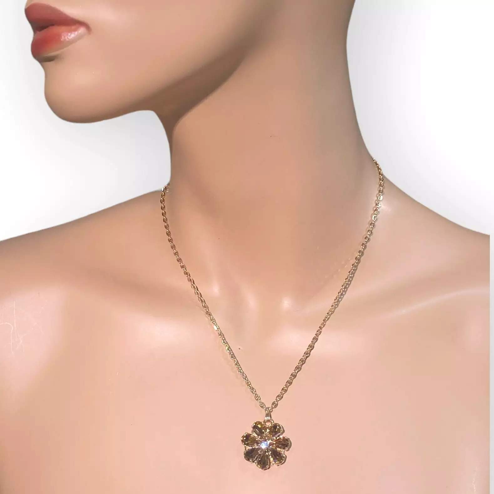 Daisy Pendant Necklace With Crystal Drops In amber and topaz shades.